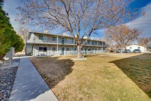 a large house with a tree in front of it at Grand Junction Vacation Rental Near University! in Grand Junction