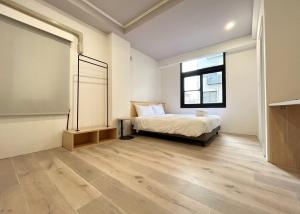 Postel nebo postele na pokoji v ubytování Yan Bin Hotel