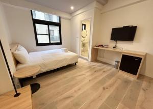TV a/nebo společenská místnost v ubytování Yan Bin Hotel + 20 fotografií