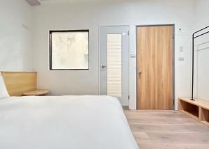 Postel nebo postele na pokoji v ubytování Yan Bin Hotel