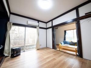 Postel nebo postele na pokoji v ubytování 富津屋 Futtsuya