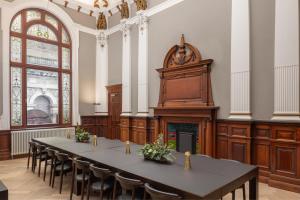 a large room with a table and chairs and a podium at AC Hotel by Marriott Glasgow in Glasgow