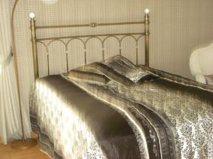 Postel nebo postele na pokoji v ubytování Dzintars