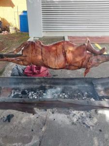 a largeopus is cooking on a grill at La Mezcla Perfecta Hostal in Managua