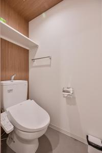 a bathroom with a white toilet in a room at MP Hotel Hakata in Fukuoka