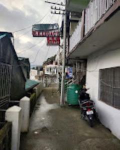 a motorcycle parked in front of a building at Hotel H. K. Legacy Nainital in Nainital