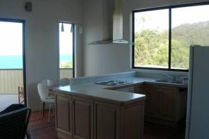 Kuchyň nebo kuchyňský kout v ubytování Blue View