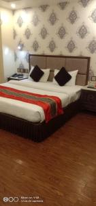 En eller flere senge i et værelse på Hotel Divinity by Audra Hotels , Mathura