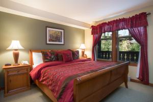 a bedroom with a large bed and a window at 2203 - One Bedroom Den Standard Eagle Springs East condo in Solitude