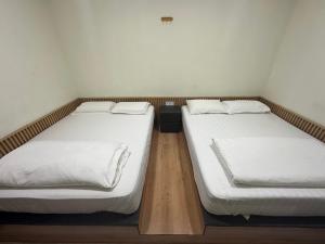 Postel nebo postele na pokoji v ubytování Grand Line Hotel Semporna