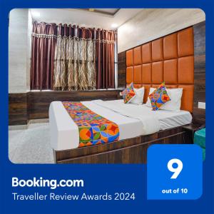 a hotel room with a bed in a room at FabHotel Brij Residency in Naiāpura