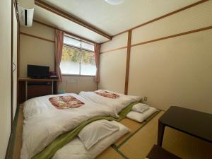Postel nebo postele na pokoji v ubytování Refre Inn Fukuzawa + 36 fotografií