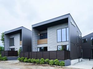 a modern house with a black and gray facade at Rakuten STAY VILLA Lake Yamanakako 105 View bath Mt Fuji View in Yamanakako