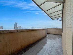 Ein Balkon oder eine Terrasse in der Unterkunft 广州沃家国际公寓