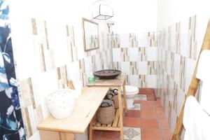 a bathroom with a sink and a toilet at Bình An Village in Vĩnh Long