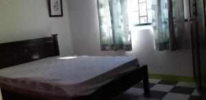 Uma cama ou camas num quarto em Flamengo