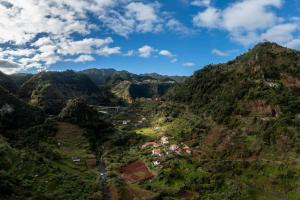 an aerial view of a mountain valley with houses at Casa da Fajã Alta with breakfast by An Island Apart in Jogo da Bola