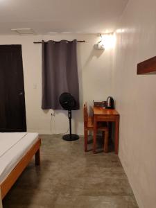 Postel nebo postele na pokoji v ubytování Solana Siargao