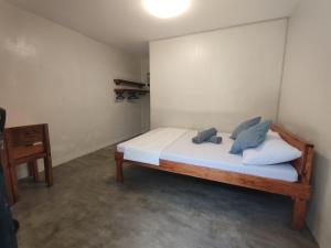 Postel nebo postele na pokoji v ubytování Solana Siargao + 3 fotografie