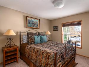 a bedroom with a bed and a window at Mountain View Home on 2 Acres in Bozeman