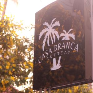 a sign for an asia branca apartment at Casa Branca Retreat in Varkala