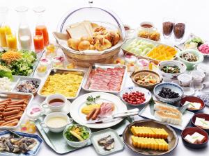 a table topped with lots of different types of food at APA Hotel Asakusa Kuramae in Tokyo