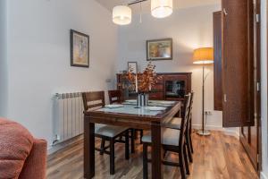 a dining room with a table and chairs at tuGuest Hermosa Apartment in Granada