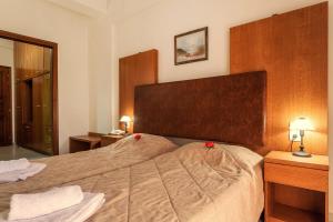 Postel nebo postele na pokoji v ubytování Aeolos Hotel