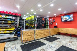 a store with a large amount of products on the wall at New Gudauri Rooms in Gudauri