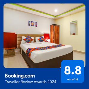 a bedroom with a bed in a room at FabExpress Broholic Suites in Hyderabad