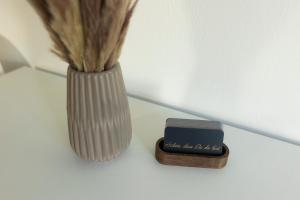 a close up of a vase and a small box at HUGOS Studio Apartment in Bensheim