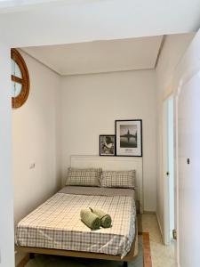 a bedroom with a bed in a room at Sevilla Central in Seville
