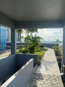 a view of a walkway from a building at Daima Suites Margonda in Perhentian Pondoktjina