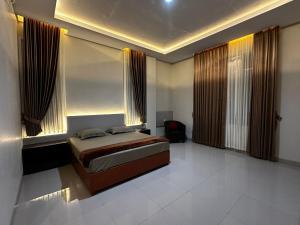 Postel nebo postele na pokoji v ubytování Grands Orchid Hotel