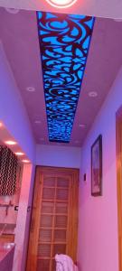a room with a ceiling with a blue lights at كبائن النصر المعمورة الشاطىء 7 in Alexandria