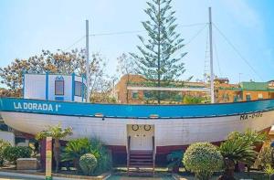 a large boat on display in front of a building at Nerja centro, playa carabeo in Nerja
