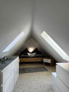 a bedroom with a bed in a attic at Ferienwohnung „Ruppbergblick“ in Zella-Mehlis