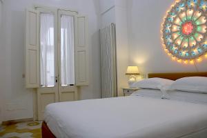 A bed or beds in a room at Li Frati Casa Vacanze