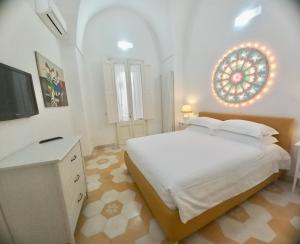 A bed or beds in a room at Li Frati Casa Vacanze