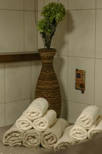 a vase with a bunch of towels in a bathroom at Chalet 1593 in Vandans