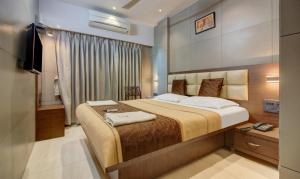Postel nebo postele na pokoji v ubytování Hotel Leela