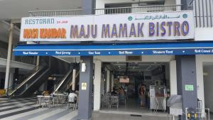a building with a sign for a manaza bistro at 3 Elements* The Garden* MRT2* Wifi* Self Check-In in Kampong Batu Sembilan