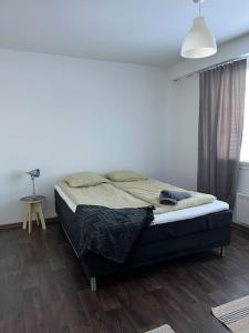 Säng eller sängar i ett rum på Apartment Talonpoika