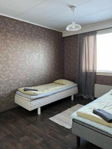 Säng eller sängar i ett rum på Apartment Talonpoika