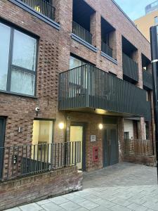 a brick building with balconies on the side of it at Remarkable 1-Bed Apartment in London with balcony in London