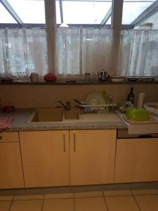 a kitchen with two sinks and a counter top at Lovely Bourg house 4 pers 2 bedr 2 bath Wifi in Charleroi