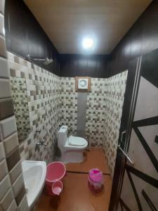 a bathroom with a toilet and a sink at The blessings home stay in Agra