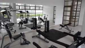 a gym with several treadmills and cardio machines at Apartment Cerro Colorado in Santiago