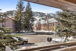 a view from a window of a street with a car at Aspen Core Renovated 2 BR, 2 BA with AC in Aspen