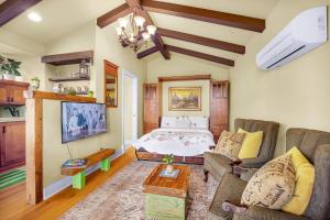 a living room with a bed and a couch at Spanish Style Cozy Studio in San Diego